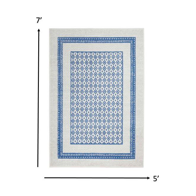 5’ x 7’ Ivory and Blue Geometric Area Rug Ivory Blue. Picture 1