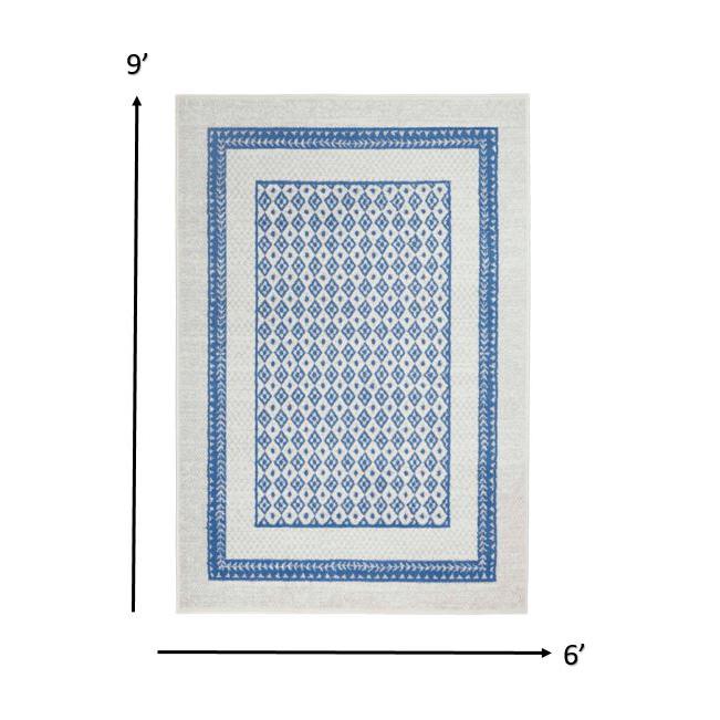 6’ x 9’ Ivory and Blue Geometric Area Rug Ivory Blue. Picture 1