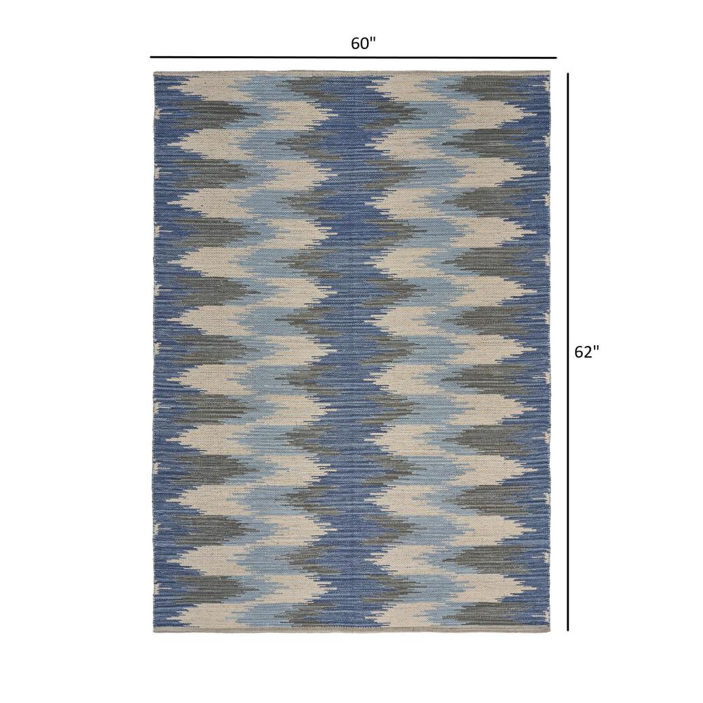 5’ x 7’ Blue and Cream Ikat Pattern Area Rug Blue/Cream. Picture 8