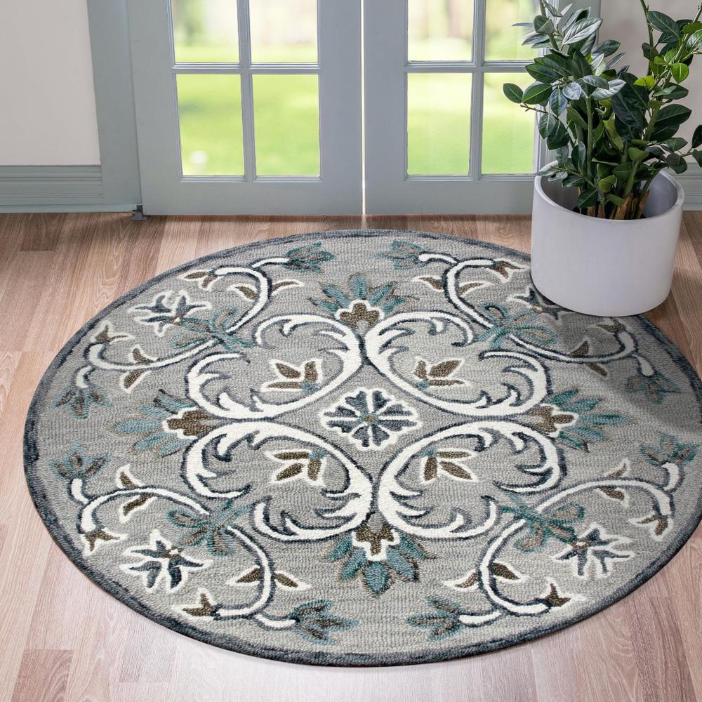 4’ Round Gray and White Filigree Area Rug Taupe/Gray/Blue/White. Picture 7