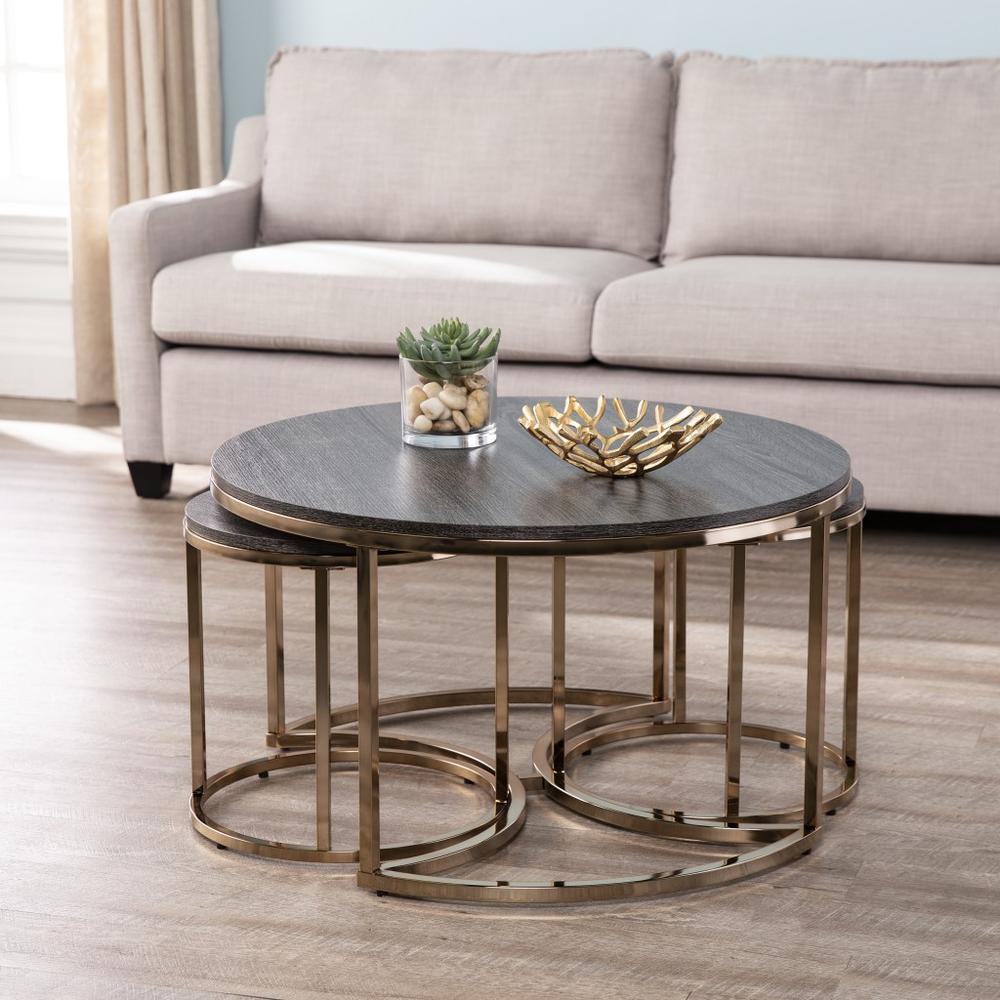 Set of Three Champagne And Charcoal Manufactured Wood And Metal Nesting Round Coffee Tables. Picture 1