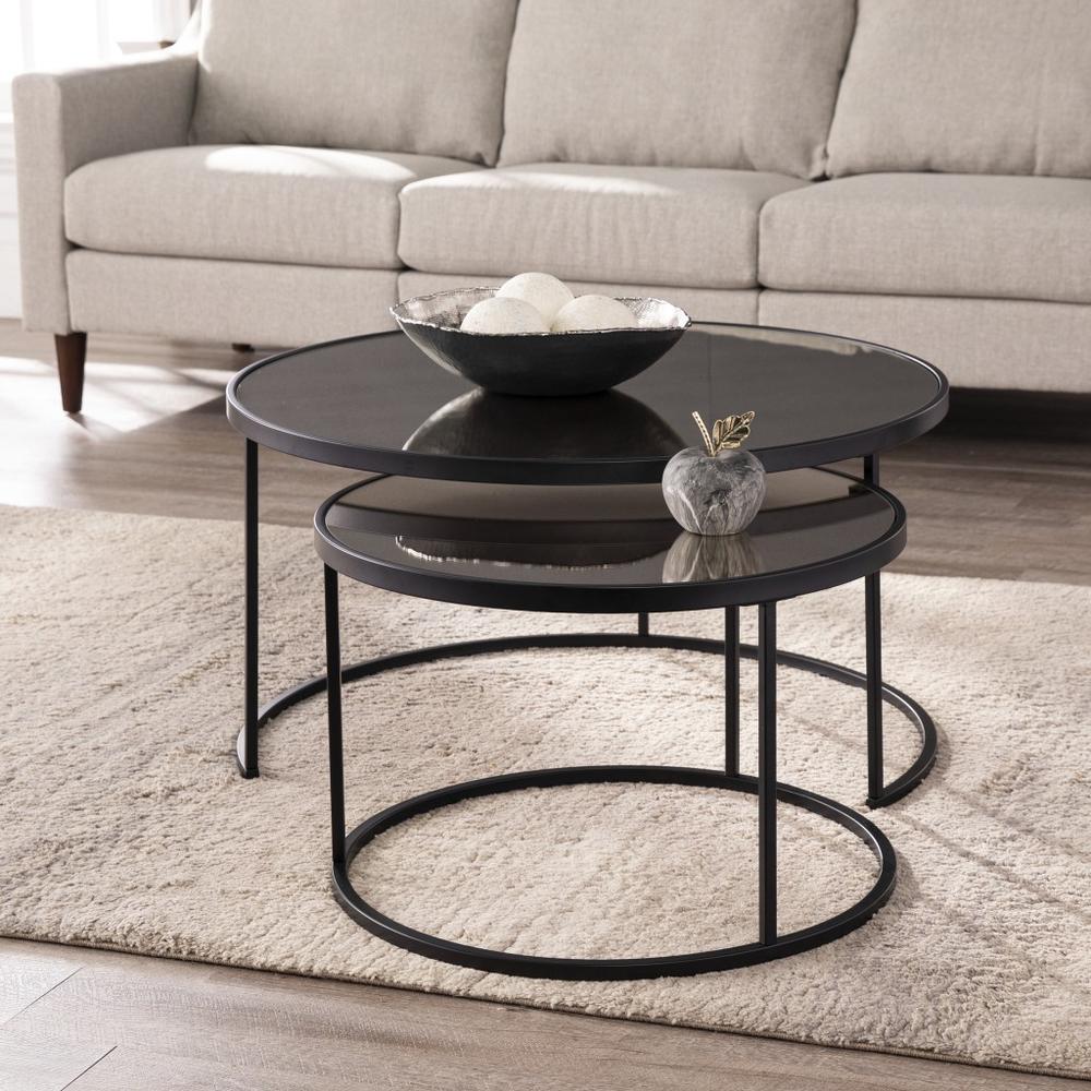 Set of Two Black And Silver Mirrored Round Nested Coffee Table Set. Picture 1