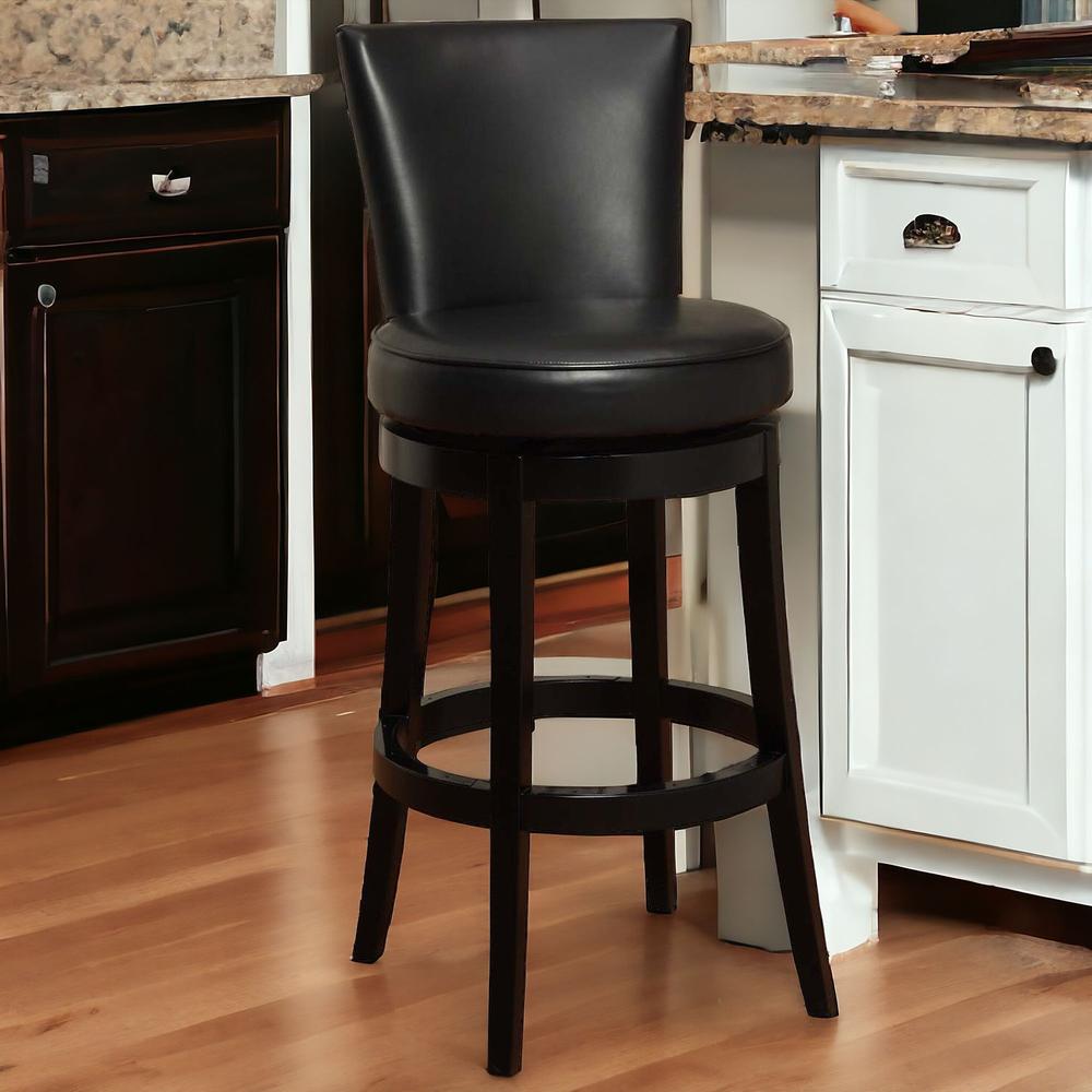 26" Black Faux Leather Round Seat Black Wood Swivel Armless Bar Stool. Picture 2