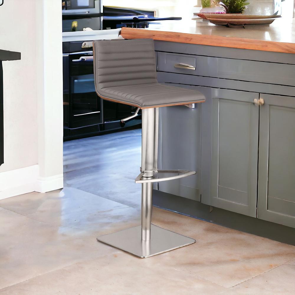 Grey Faux Leather Armless Swivel Bar Stool with Brushed Stainless Steel Base. Picture 2