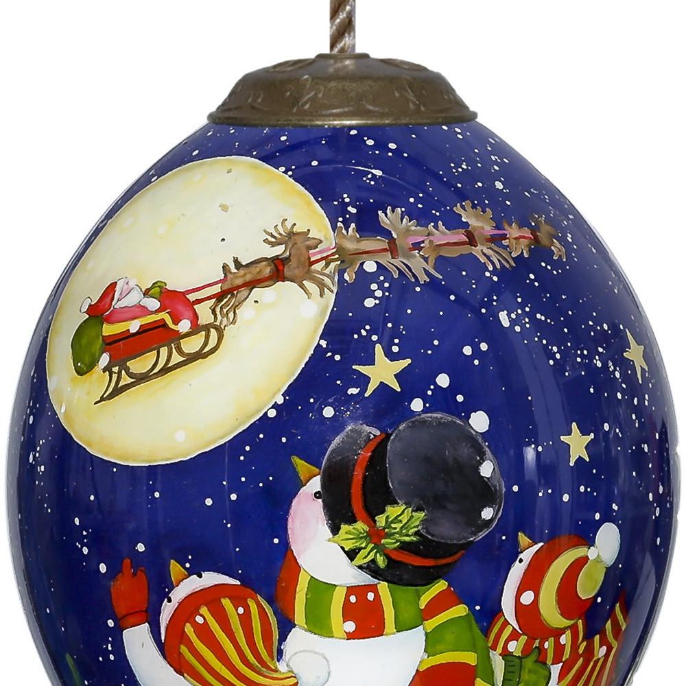 Snowmen Family Watching Santa on a Sleigh Hand Painted Mouth Blown Glass Ornament. Picture 3