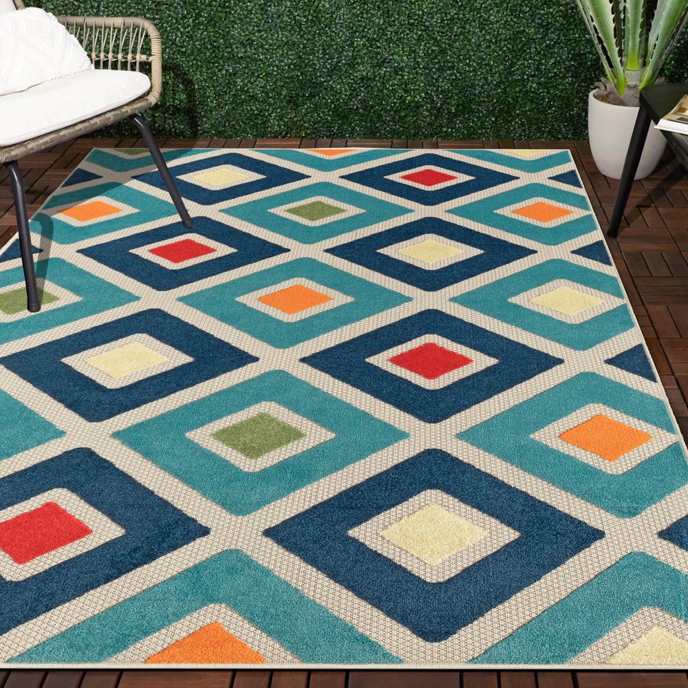 5' X 8' Blue And Ivory Geometric Stain Resistant Indoor Outdoor Area Rug. Picture 7