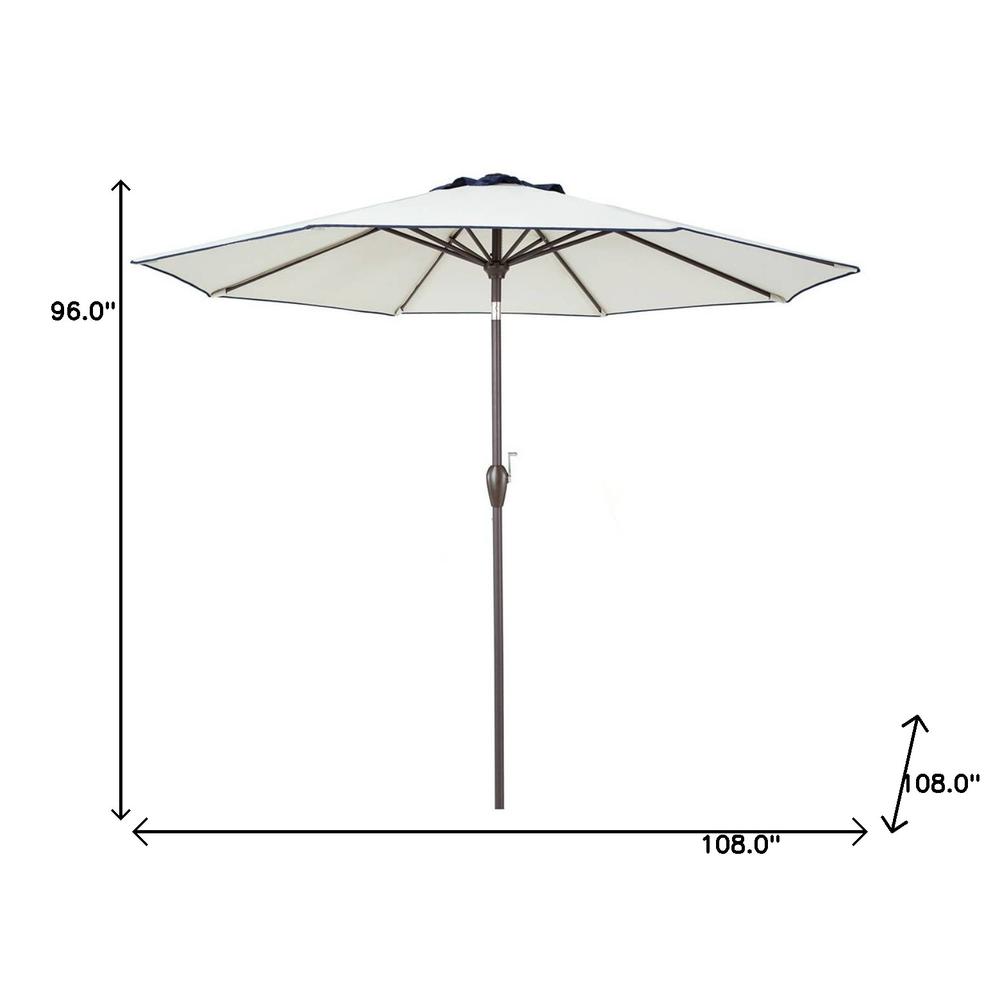 9' Beige And Navy Polyester Octagonal Tilt Market Patio Umbrella. Picture 6