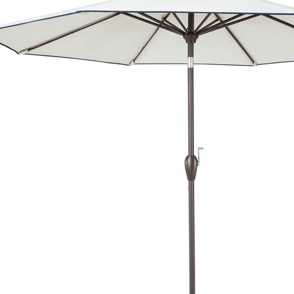 9' Beige And Navy Polyester Octagonal Tilt Market Patio Umbrella. Picture 5