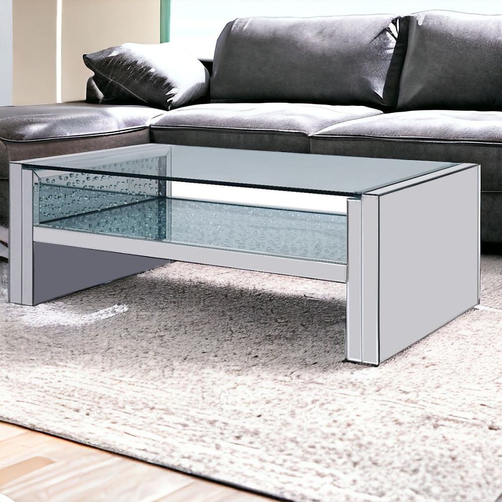 47" Silver And Clear Glass Rectangular Mirrored Coffee Table With Shelf. Picture 1