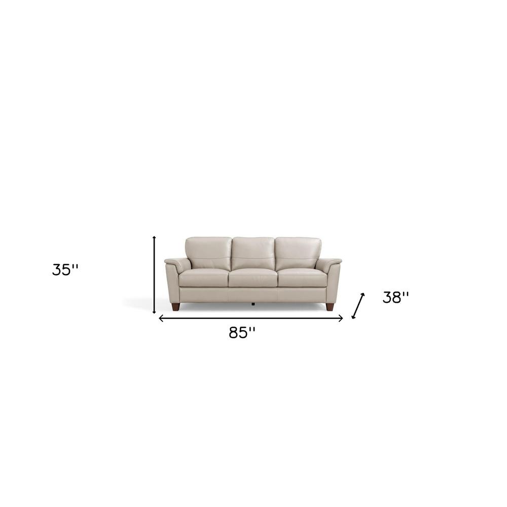85" Beige Leather And Black Sofa. Picture 5