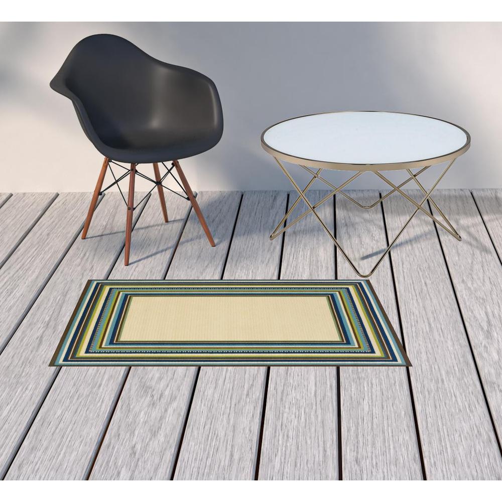 2' X 4' Ivory and Blue Striped Stain Resistant Indoor Outdoor Area Rug. Picture 2