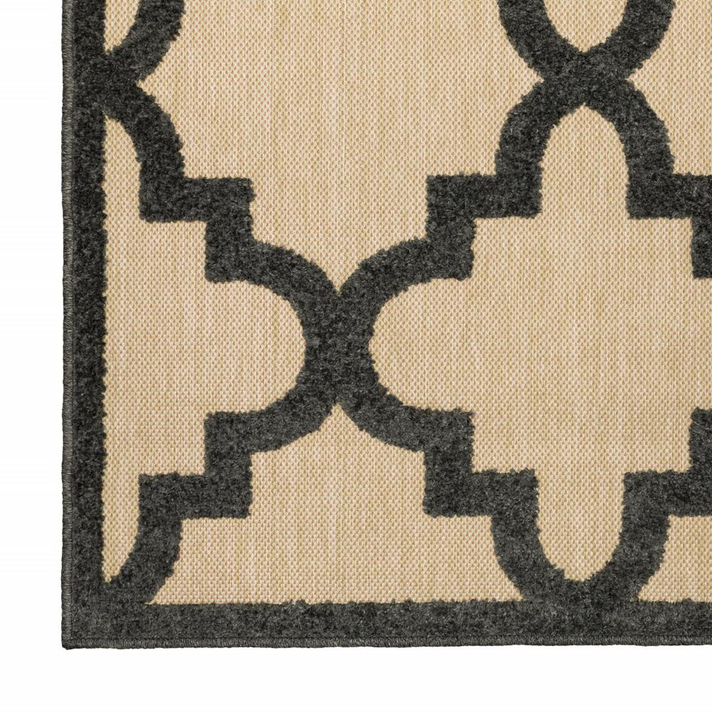 2' X 8' Beige and Black Geometric Stain Resistant Indoor Outdoor Area Rug. Picture 1