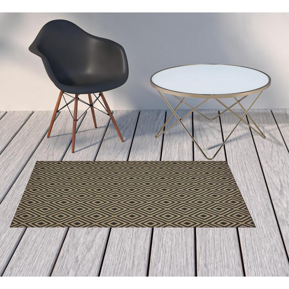 2' X 4' Black and Tan Geometric Stain Resistant Indoor Outdoor Area Rug. Picture 2