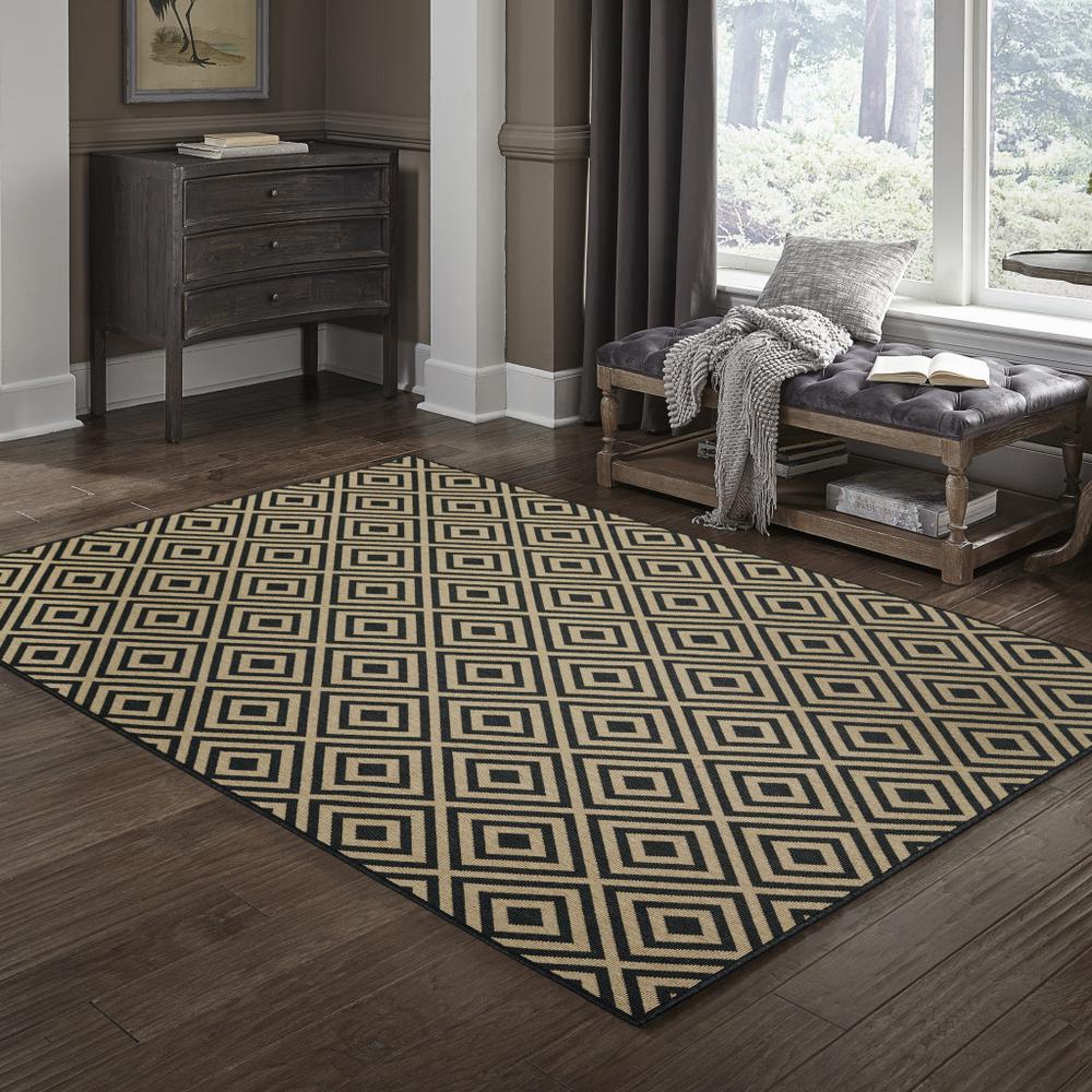 2' X 4' Black and Tan Geometric Stain Resistant Indoor Outdoor Area Rug. Picture 8