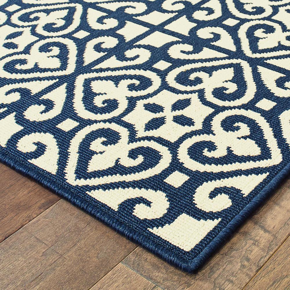 2' X 4' Ivory and Blue Geometric Stain Resistant Indoor Outdoor Area Rug. Picture 3