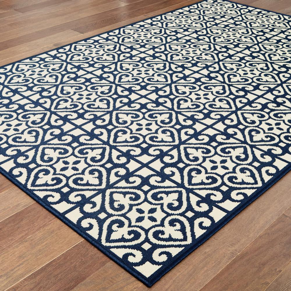2' X 4' Ivory and Blue Geometric Stain Resistant Indoor Outdoor Area Rug. Picture 4