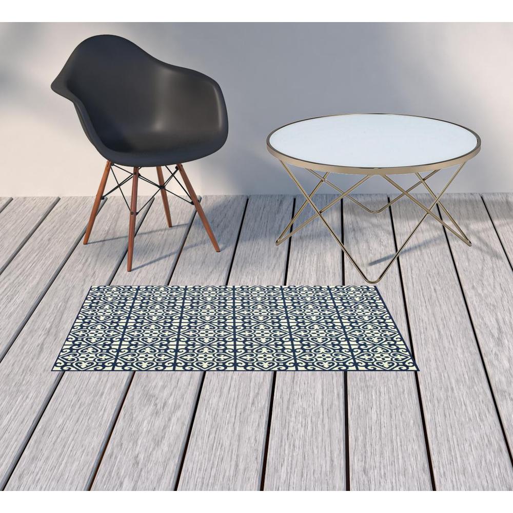 2' X 4' Ivory and Blue Geometric Stain Resistant Indoor Outdoor Area Rug. Picture 2