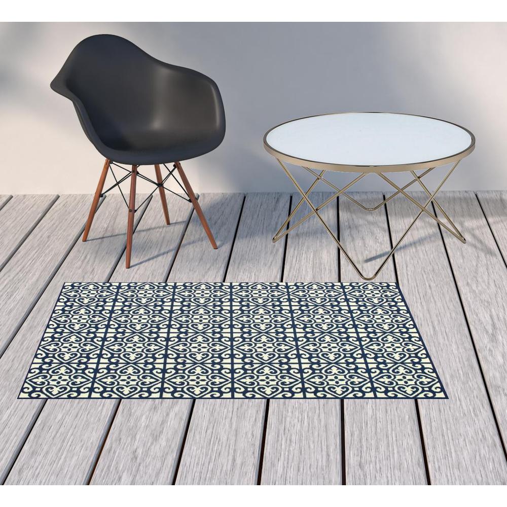 2' X 4' Ivory and Blue Geometric Stain Resistant Indoor Outdoor Area Rug. Picture 2
