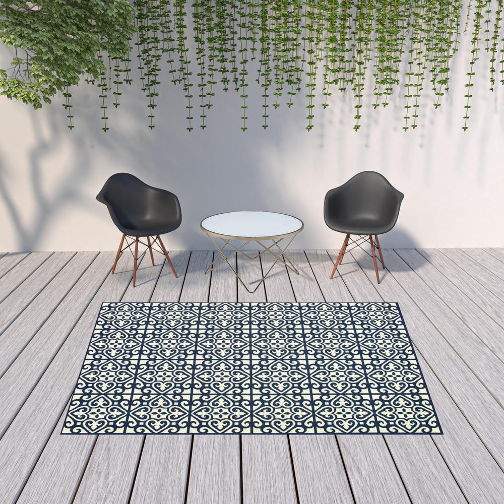 7' x 10' Ivory and Blue Geometric Stain Resistant Indoor Outdoor Area Rug. Picture 2