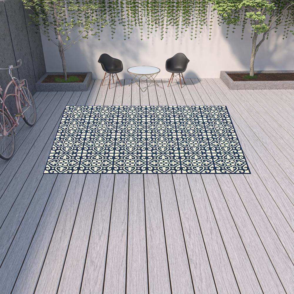 9' X 13' Ivory and Blue Geometric Stain Resistant Indoor Outdoor Area Rug. Picture 2