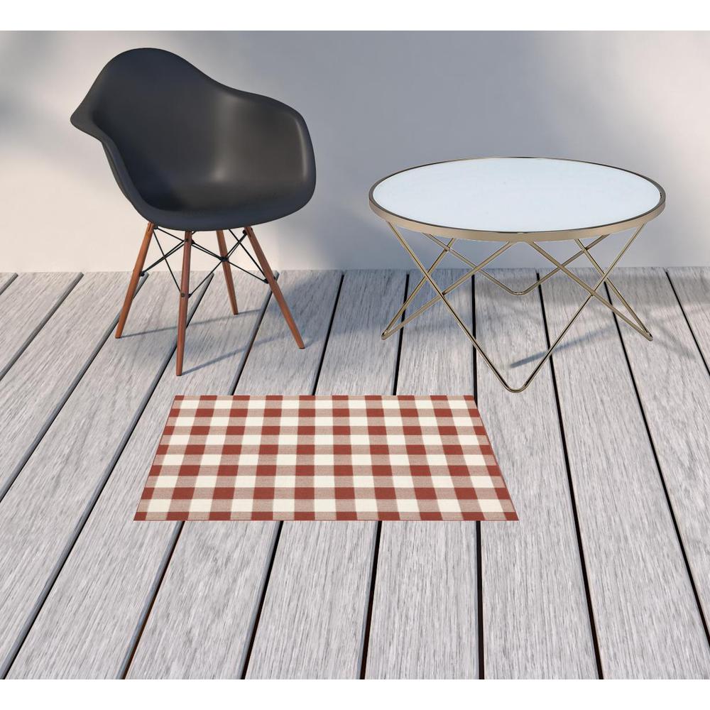 2' x 3' Red and Ivory Geometric Stain Resistant Indoor Outdoor Area Rug. Picture 2