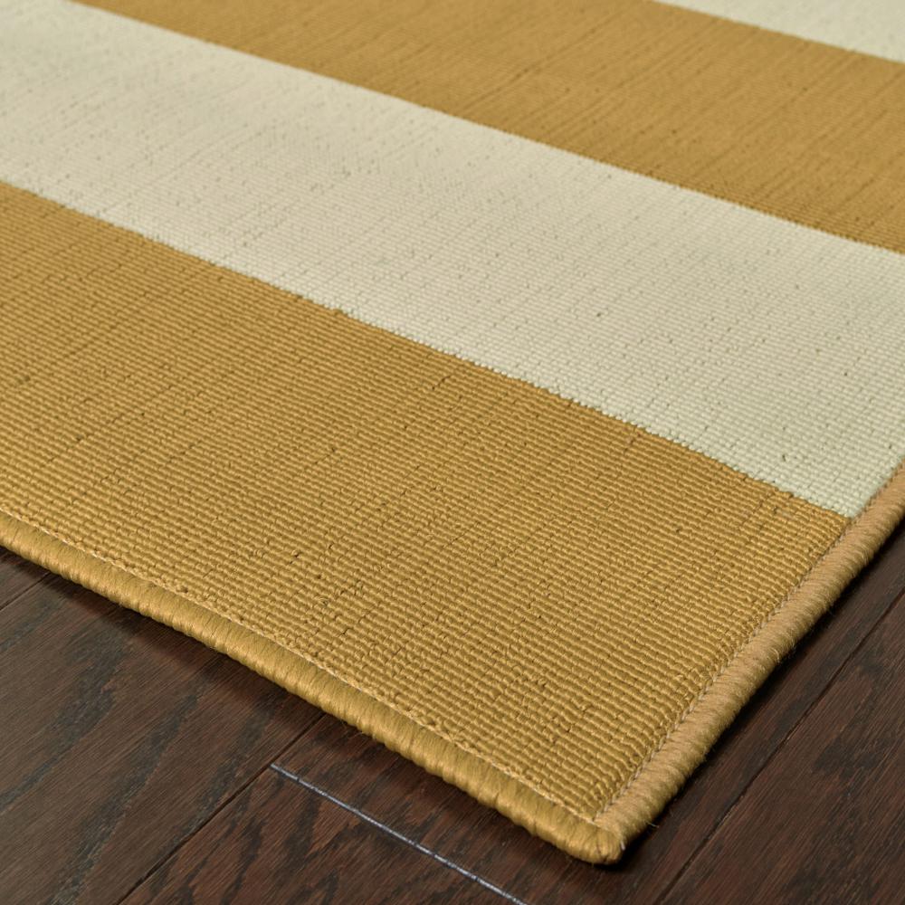 2' X 8' Gold and Ivory Geometric Stain Resistant Indoor Outdoor Area Rug. Picture 3