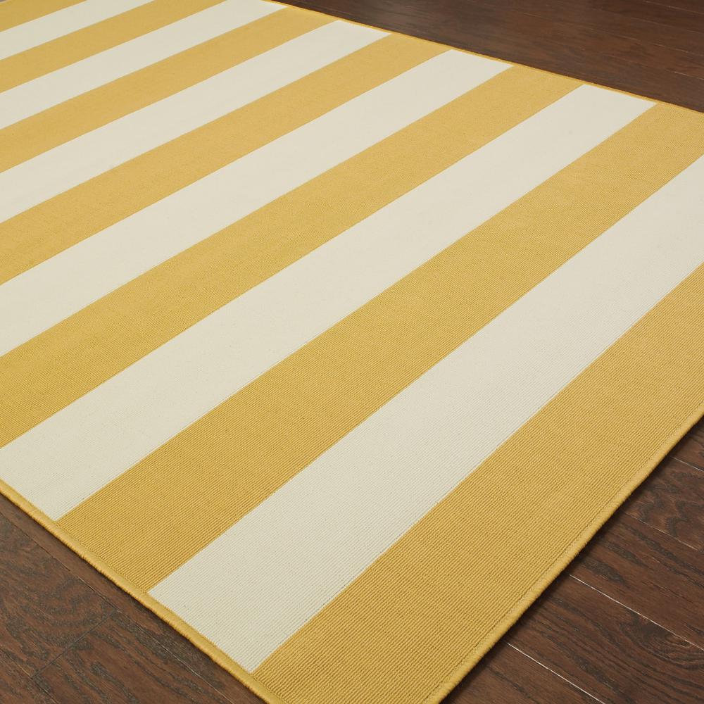 2' X 4' Gold and Ivory Geometric Stain Resistant Indoor Outdoor Area Rug. Picture 4