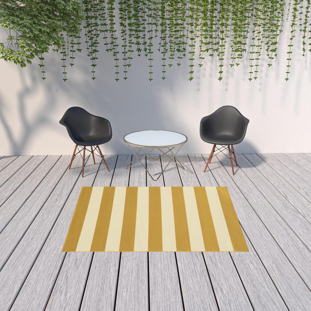 5' x 8' Gold and Ivory Geometric Stain Resistant Indoor Outdoor Area Rug. Picture 2