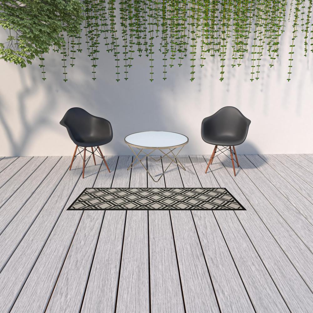 2' X 7' Beige and Black Geometric Stain Resistant Indoor Outdoor Area Rug. Picture 2