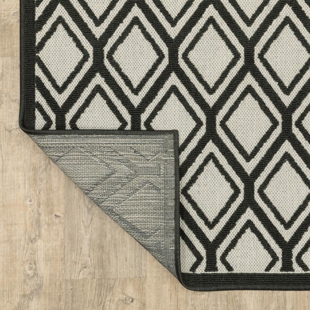 2' X 7' Beige and Black Geometric Stain Resistant Indoor Outdoor Area Rug. Picture 7