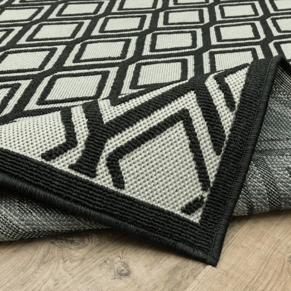 2' X 7' Beige and Black Geometric Stain Resistant Indoor Outdoor Area Rug. Picture 9