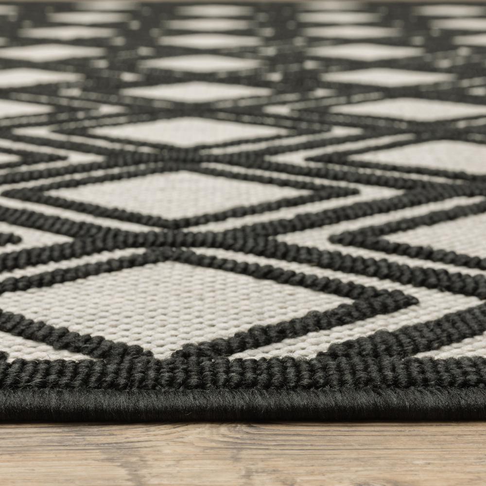 5' x 7' Beige and Black Geometric Stain Resistant Indoor Outdoor Area Rug. Picture 5