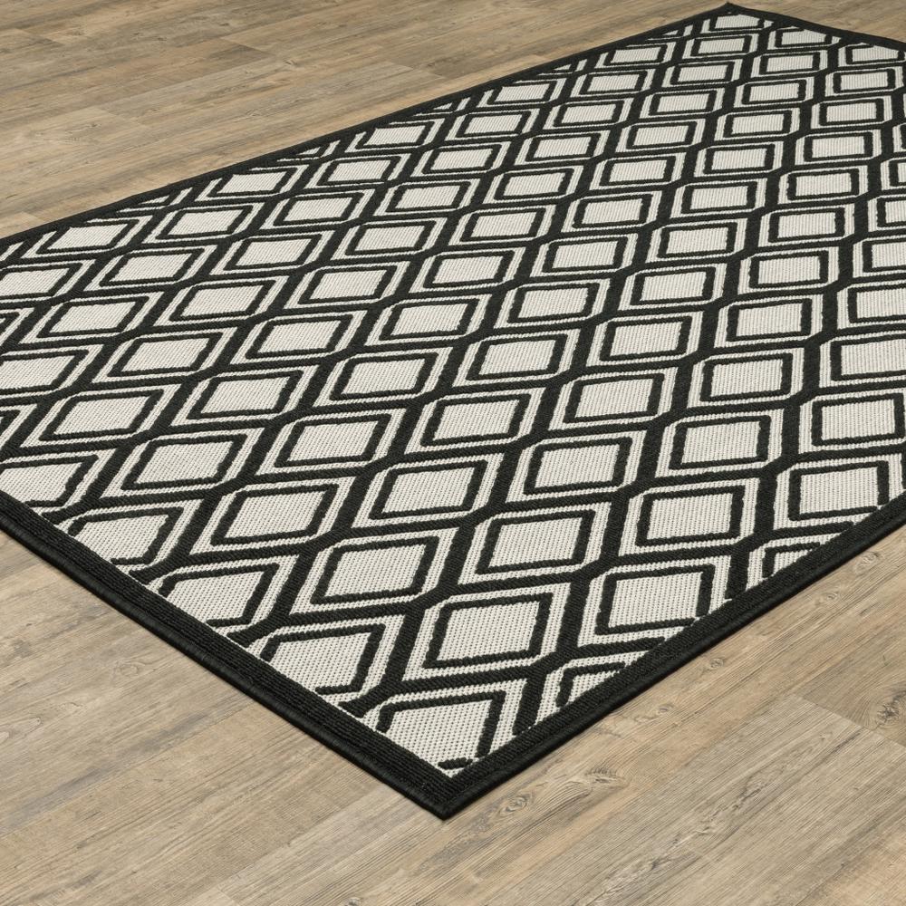 5' x 7' Beige and Black Geometric Stain Resistant Indoor Outdoor Area Rug. Picture 6