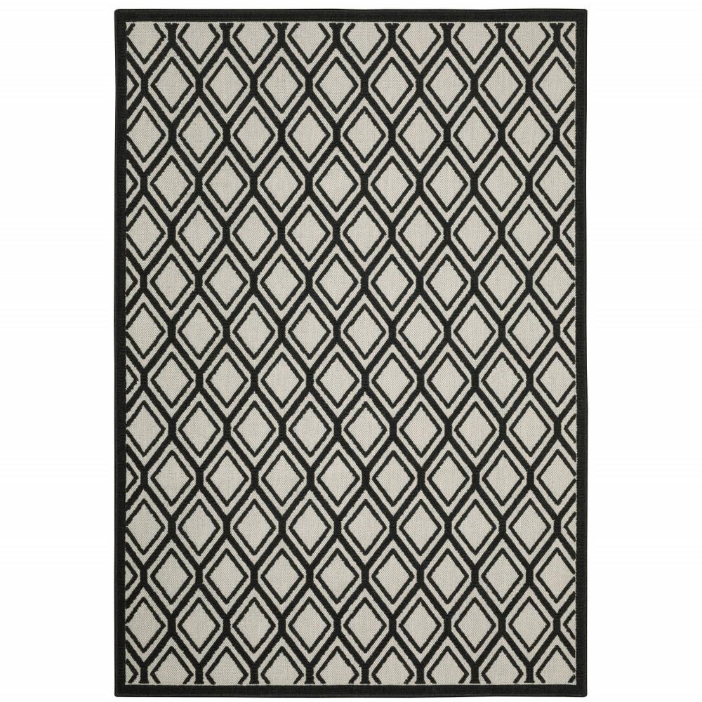7' x 9' Beige and Black Geometric Stain Resistant Indoor Outdoor Area Rug. Picture 1