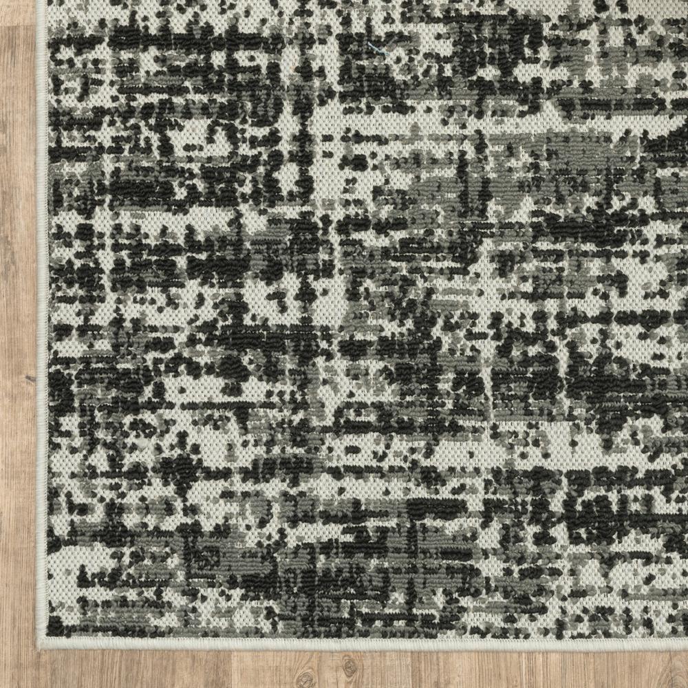 2' X 7' Beige and Black Abstract Stain Resistant Indoor Outdoor Area Rug. Picture 2