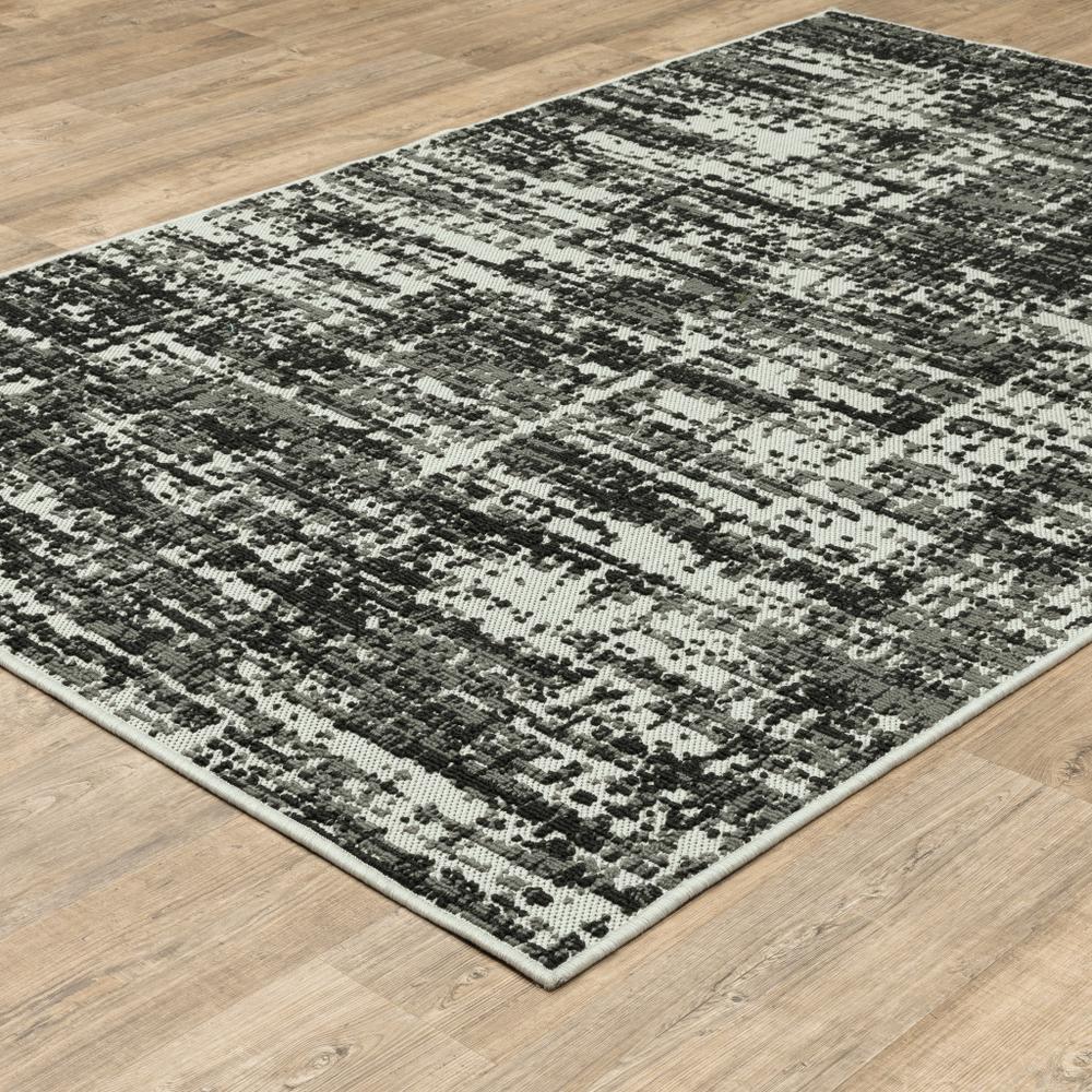 7' x 9' Beige and Black Abstract Stain Resistant Indoor Outdoor Area Rug. Picture 5