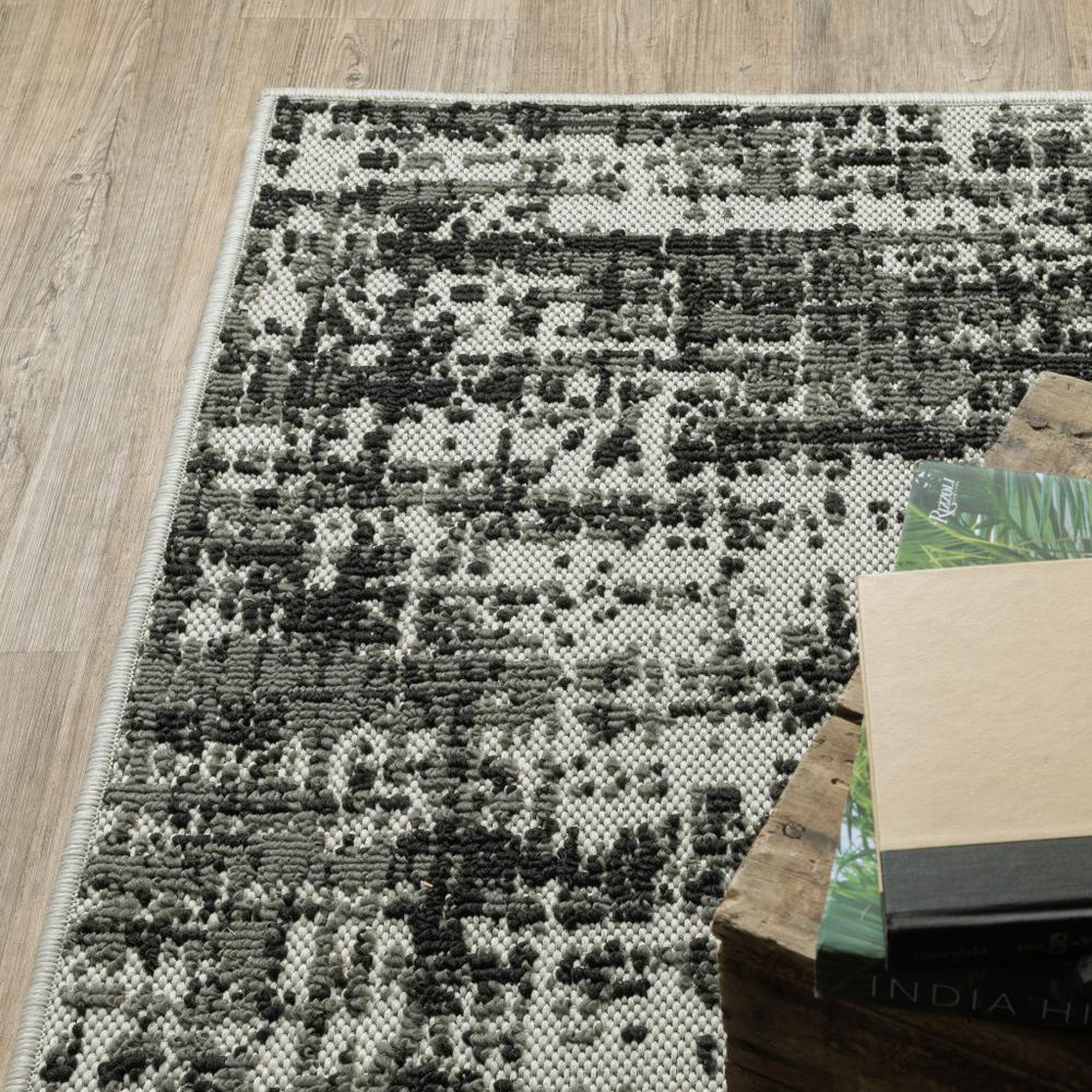 7' x 9' Beige and Black Abstract Stain Resistant Indoor Outdoor Area Rug. Picture 6