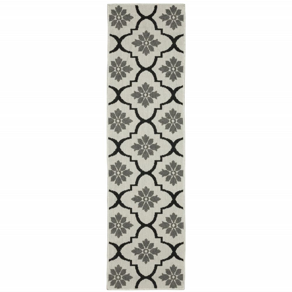2' X 7' Beige and Black Geometric Stain Resistant Indoor Outdoor Area Rug. Picture 1