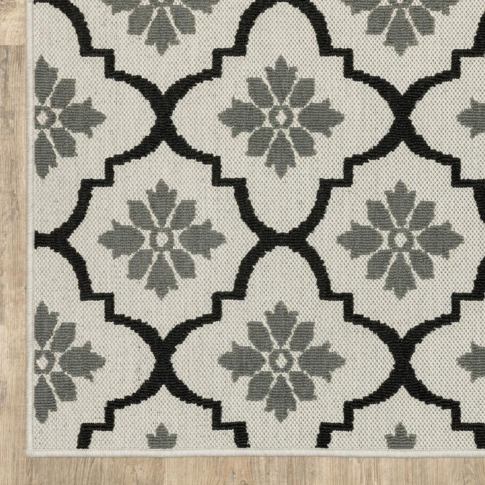 2' X 7' Beige and Black Geometric Stain Resistant Indoor Outdoor Area Rug. Picture 5