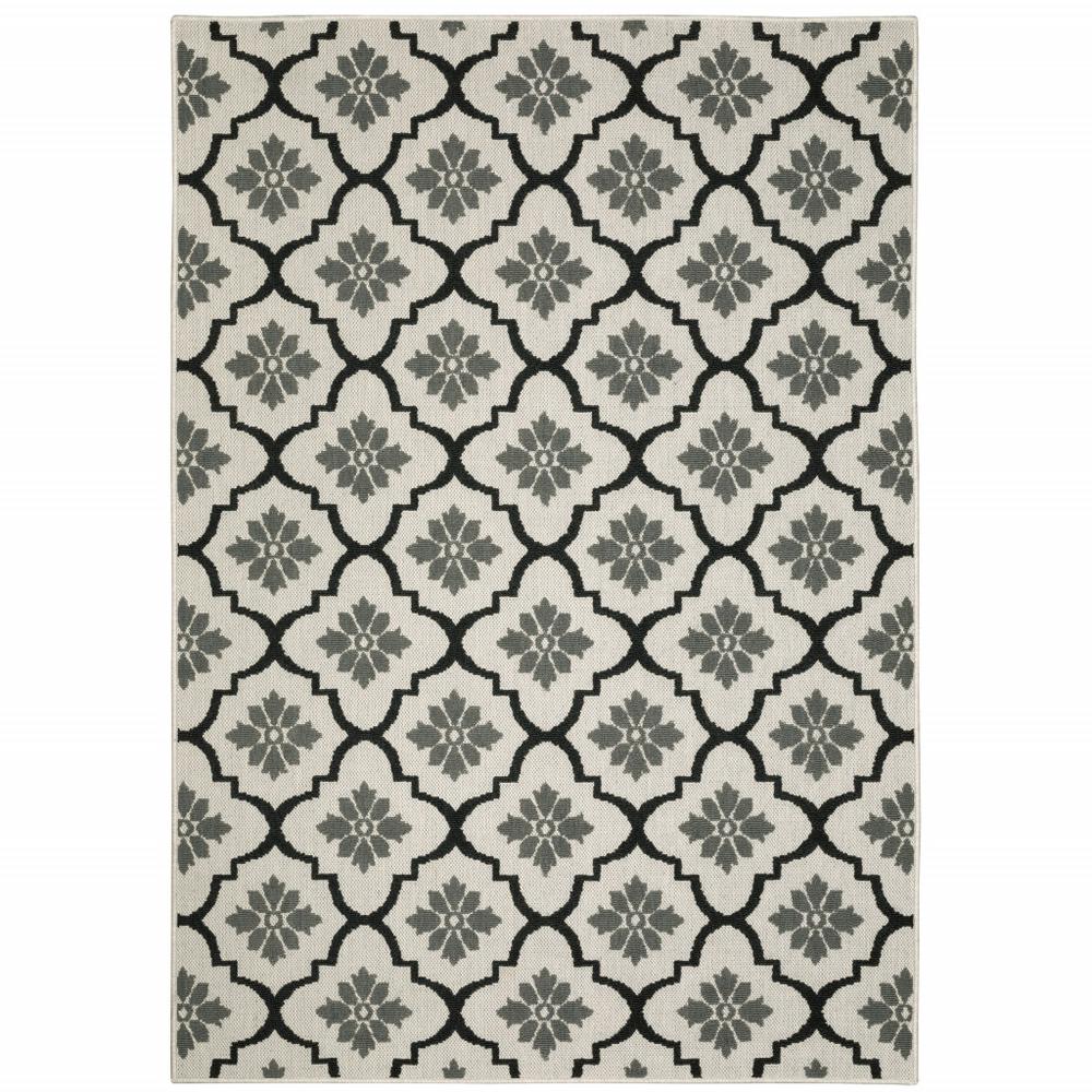 5' x 7' Beige and Black Geometric Stain Resistant Indoor Outdoor Area Rug. Picture 1
