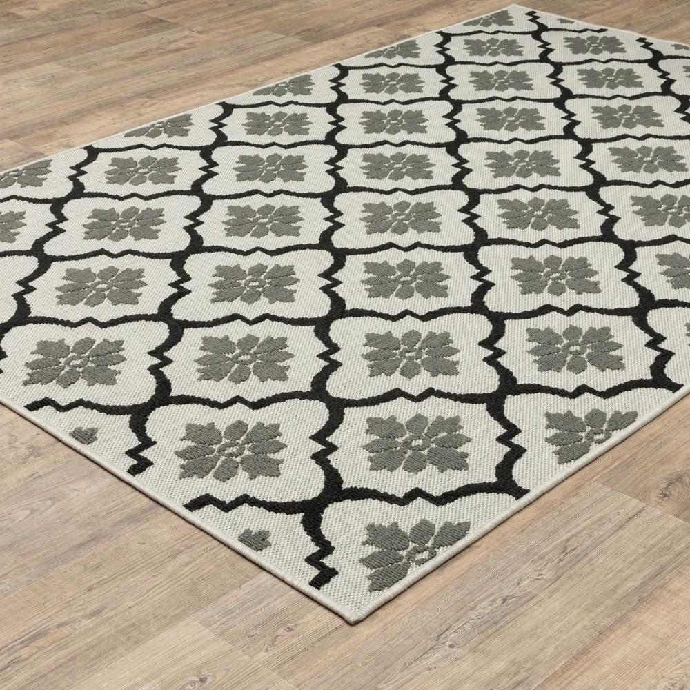 5' x 7' Beige and Black Geometric Stain Resistant Indoor Outdoor Area Rug. Picture 7