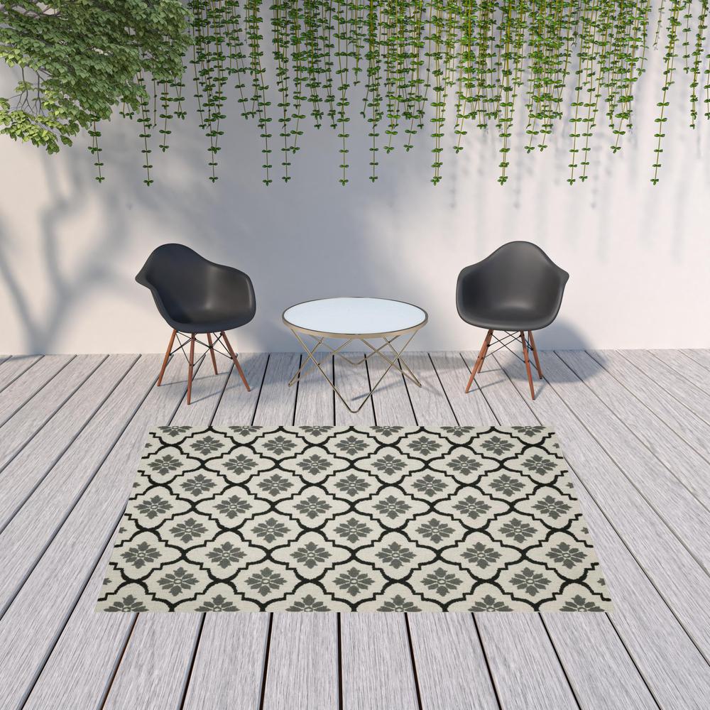 7' x 9' Beige and Black Geometric Stain Resistant Indoor Outdoor Area Rug. Picture 2
