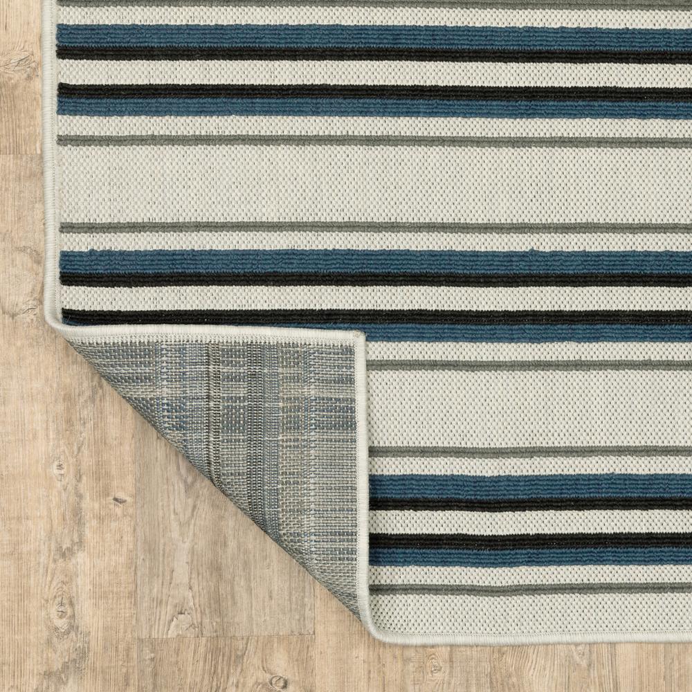 7' x 9' Blue and Beige Geometric Stain Resistant Indoor Outdoor Area Rug. Picture 9