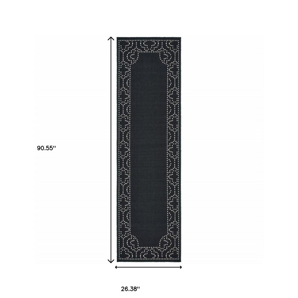2' X 8' Black and Ivory Stain Resistant Indoor Outdoor Area Rug. Picture 5