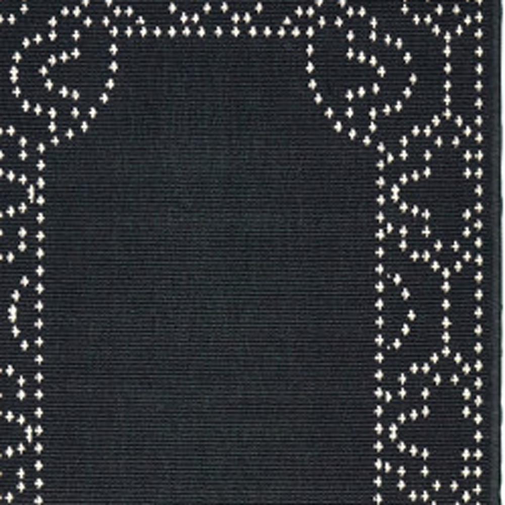 2' X 8' Black and Ivory Stain Resistant Indoor Outdoor Area Rug. Picture 3
