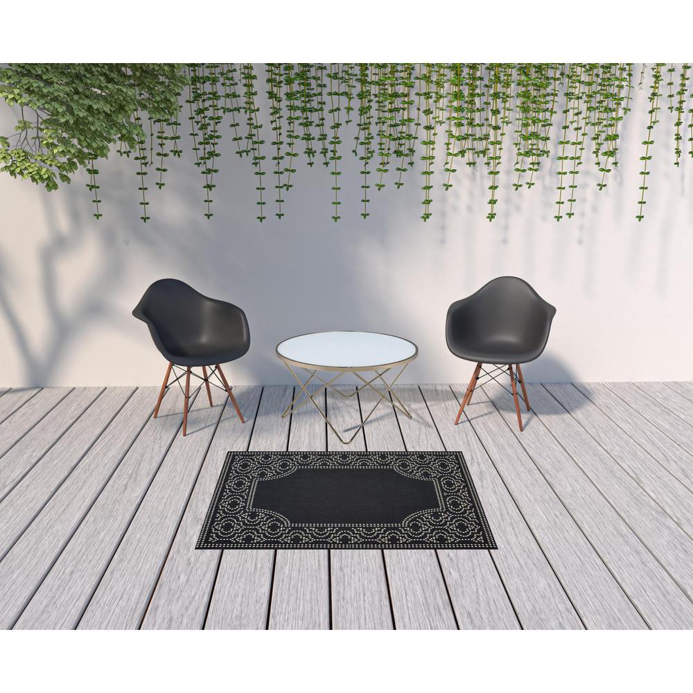 4' x 6' Black and Ivory Stain Resistant Indoor Outdoor Area Rug. Picture 2