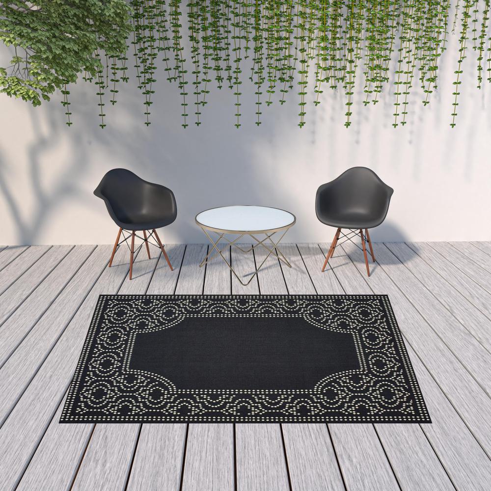 7' x 10' Black and Ivory Stain Resistant Indoor Outdoor Area Rug. Picture 2