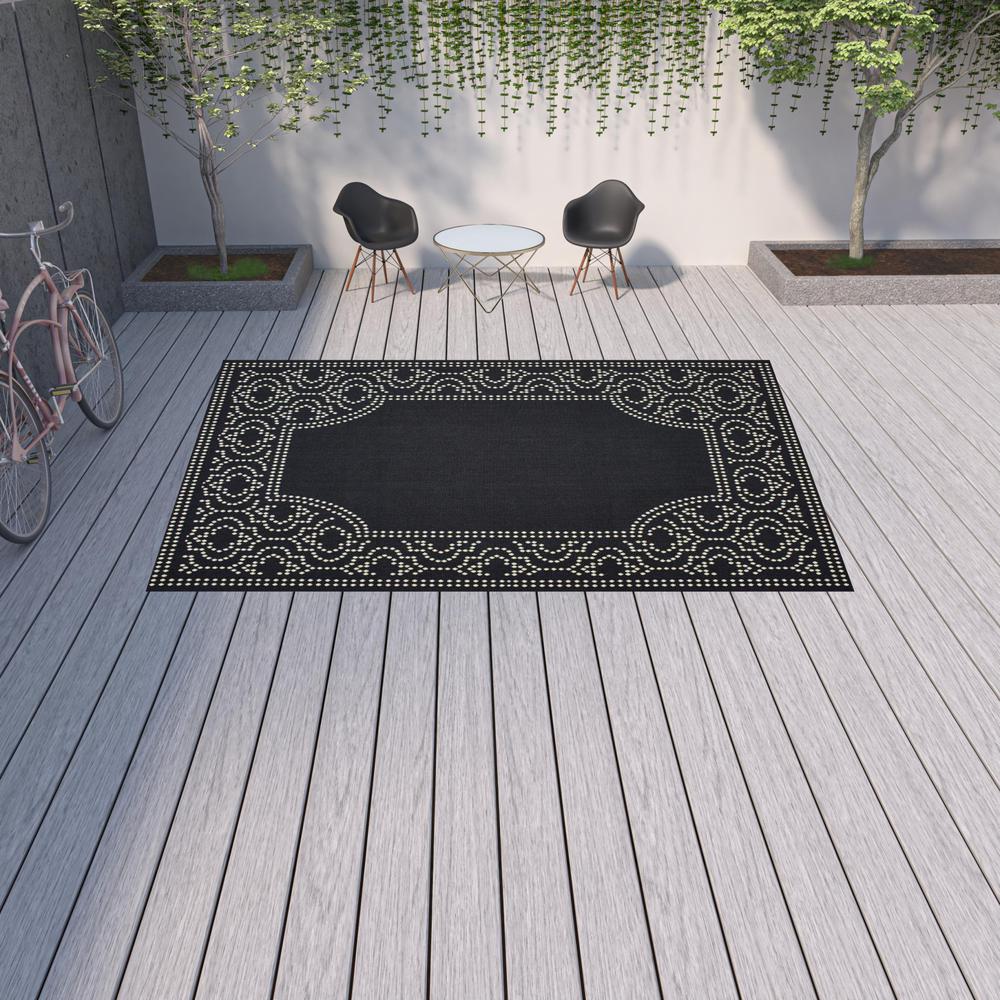 9' X 13' Black and Ivory Stain Resistant Indoor Outdoor Area Rug. Picture 2