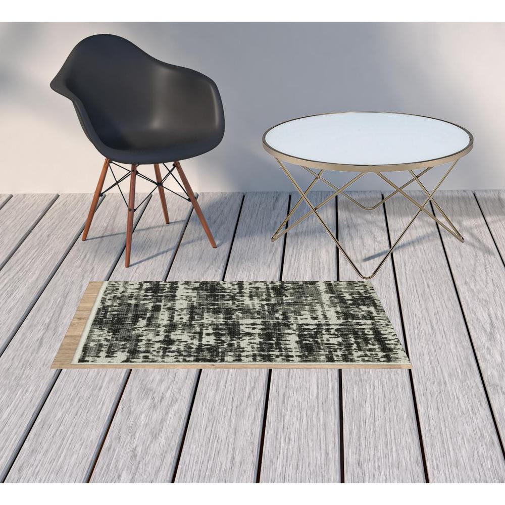 2' X 4' Beige and Black Abstract Stain Resistant Indoor Outdoor Area Rug. Picture 3