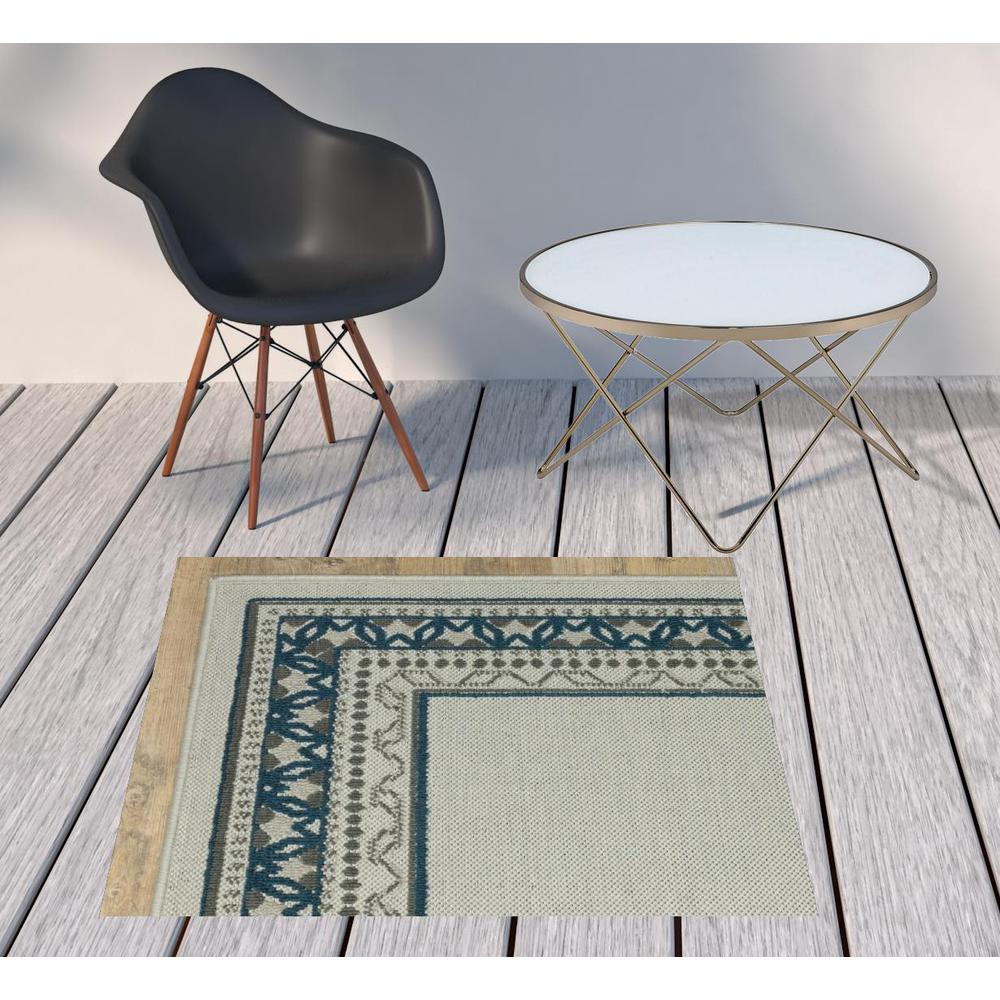 2' X 4' Blue and Beige Stain Resistant Indoor Outdoor Area Rug. Picture 3